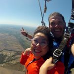 Didi and Student all Smiles under Parachute at Dallas Skydive Center!